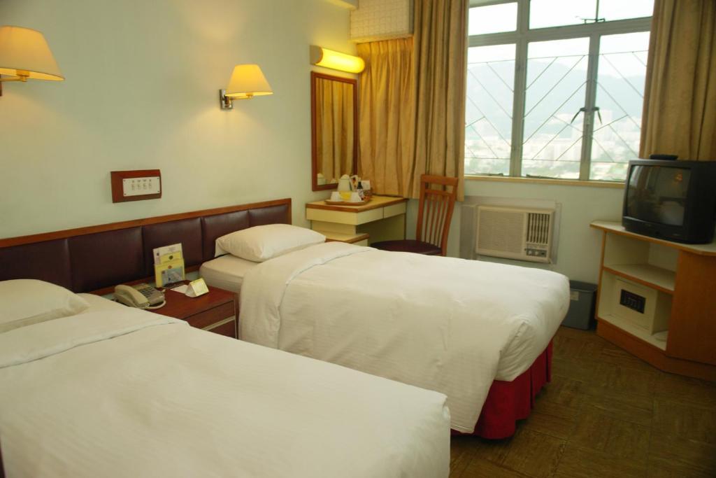 Caritas Lodge Цзюлун Номер фото