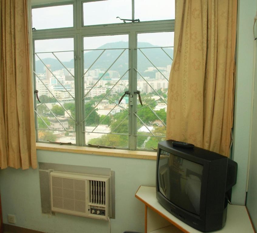 Caritas Lodge Цзюлун Номер фото
